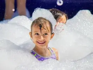 Children playing in foam at an All41Events foam party in Central Florida