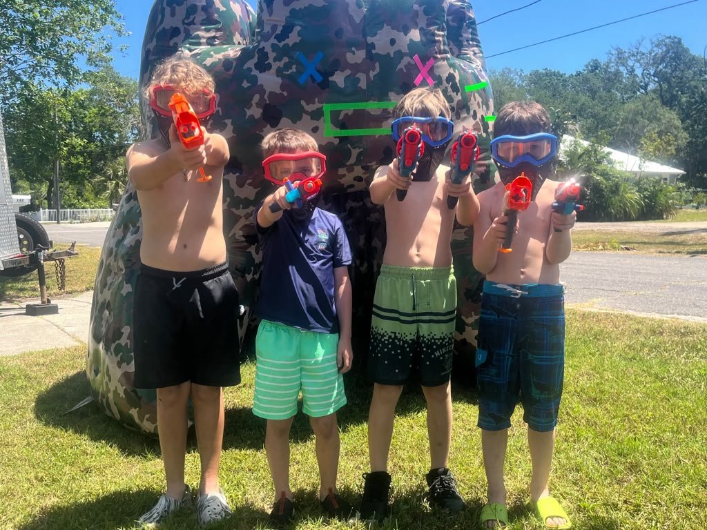 Two children ready for a Nerf battle