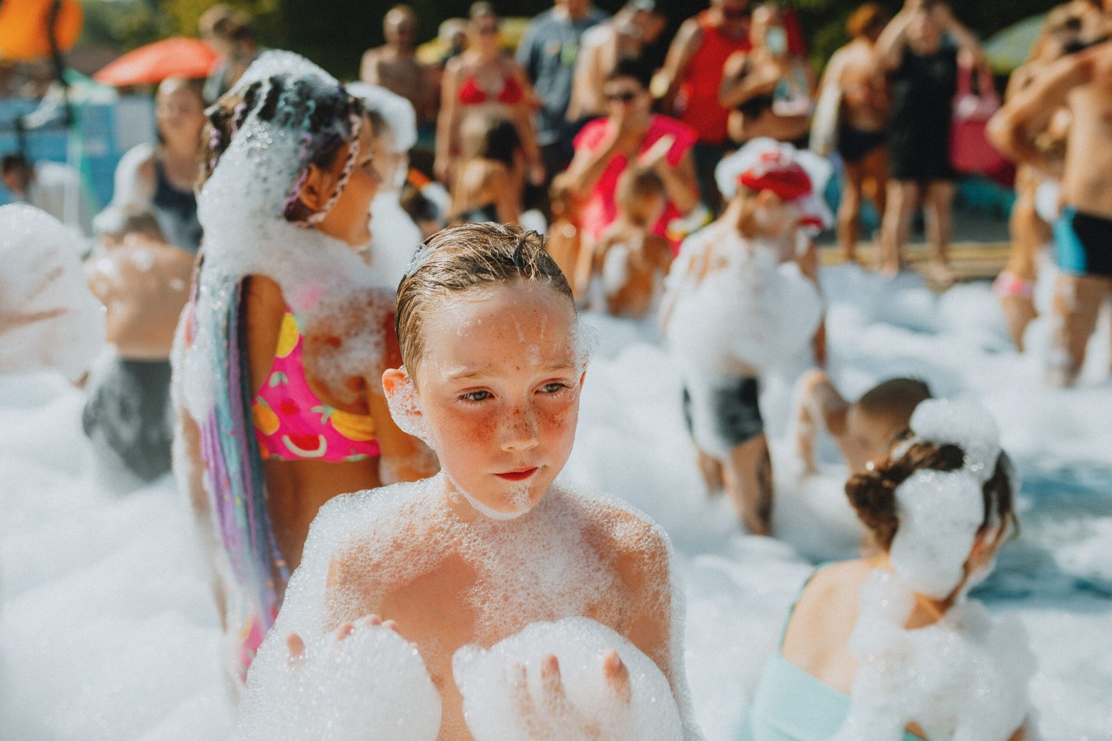 Kid playing in foam at an All41Events foam party rental in Orlando FL